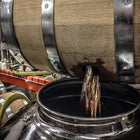 Studio Distilling barrel being drained