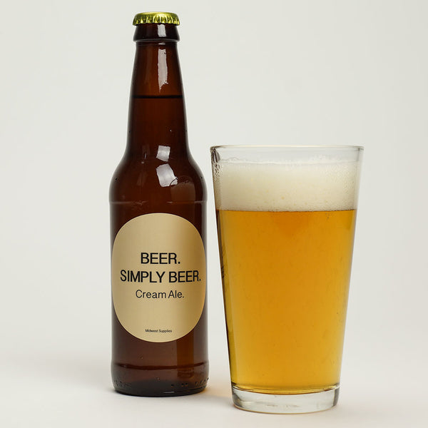 Beer. Simply Beer homebrew in a glass beside a labeled bottle