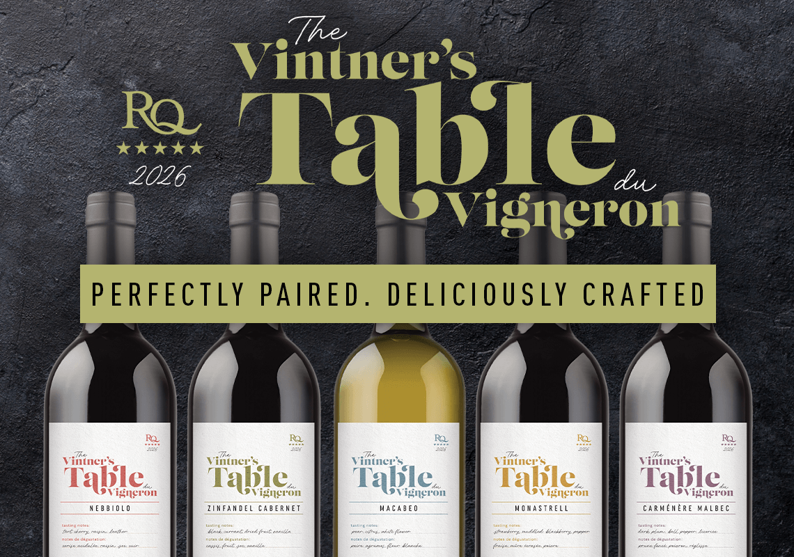 Bottles of Vintner's Table wine with brand logo and text on a dark background
