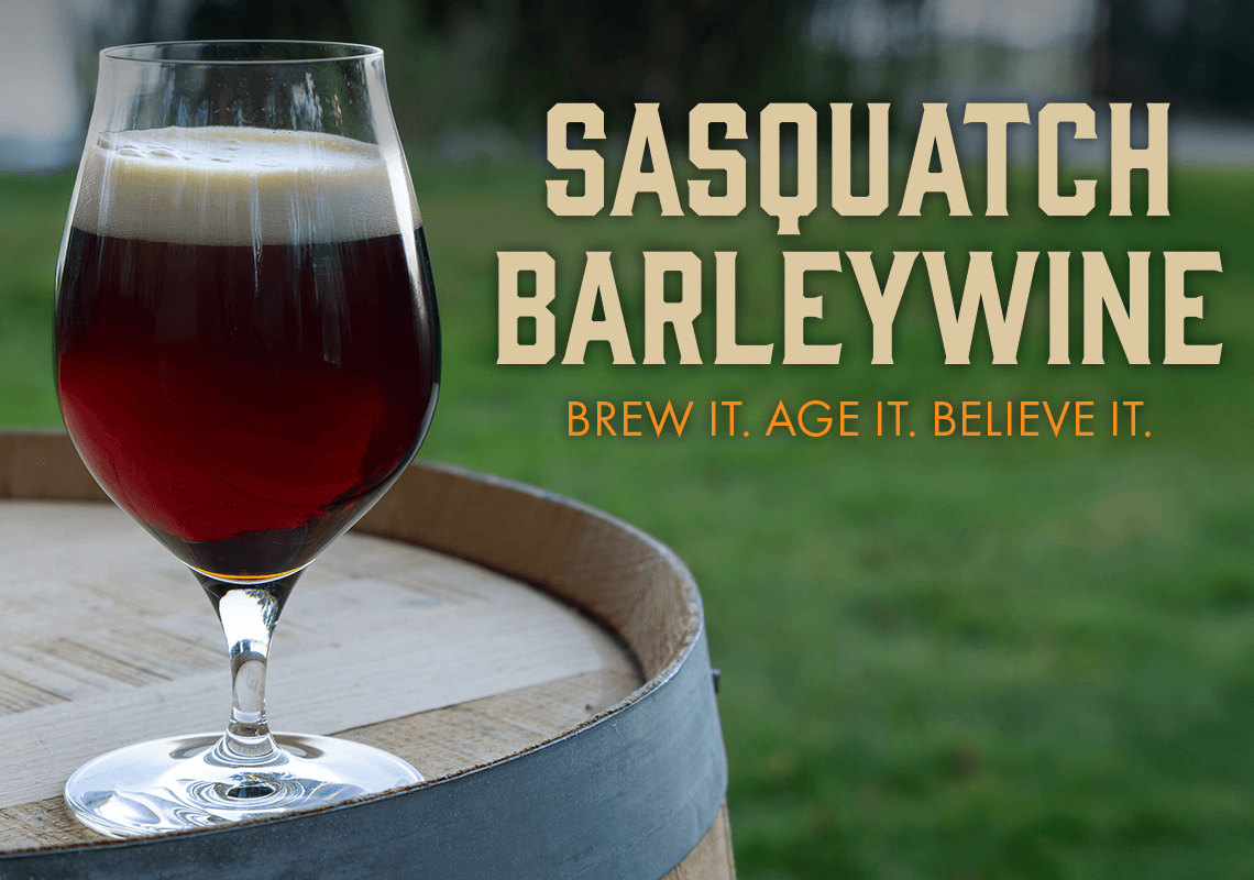 Glass of Sasquatch Barleywine on a wooden barrel with grass in the background. Brew it. Age it. Believe it.