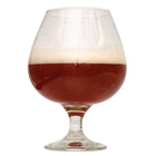 Glass filled with Sasquatch Barleywine on a white background
