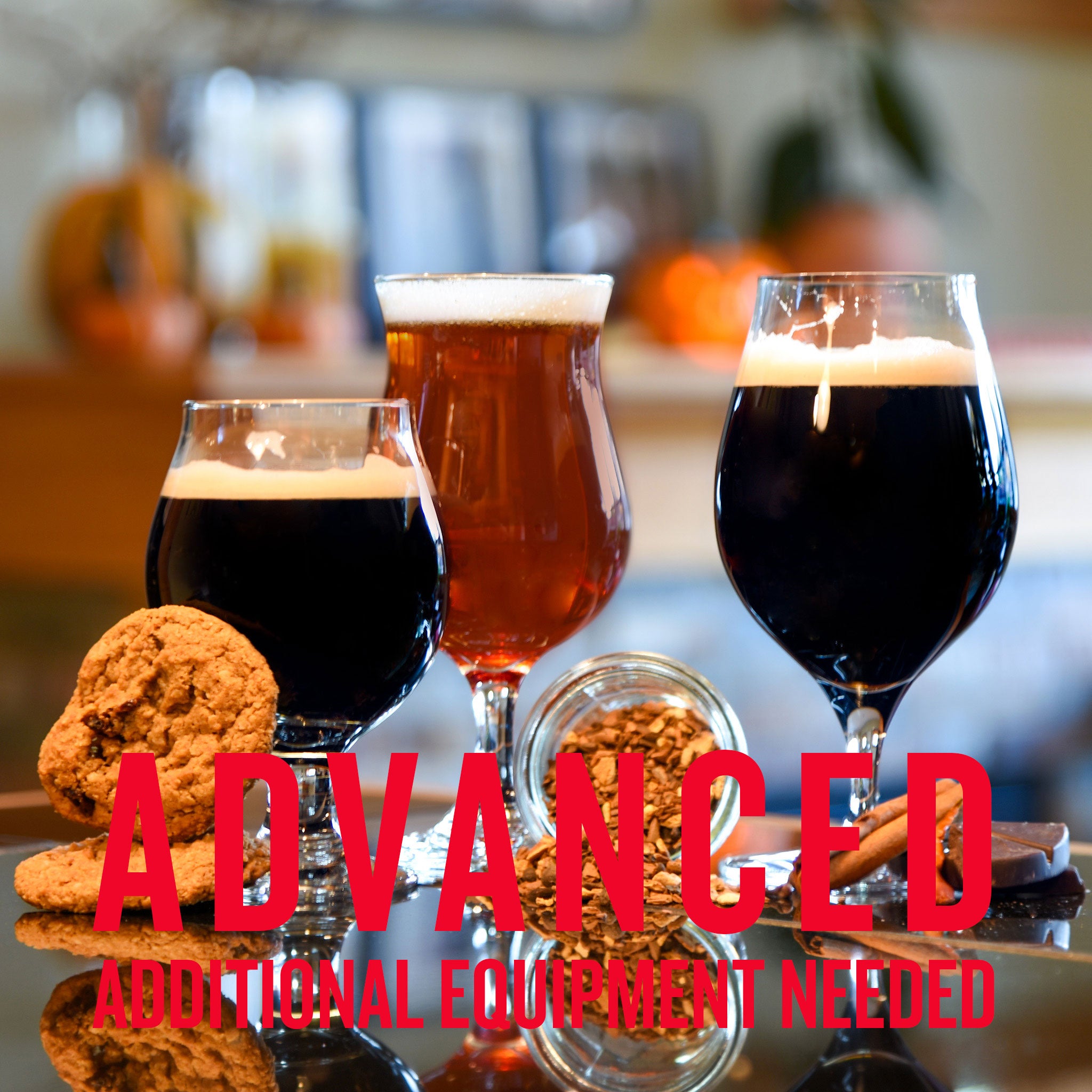 Three dark and amber beers with frothy heads on a reflective surface, surrounded by cookies, spices, and a jar of dried ingredients. Text reads: “ADVANCED – ADDITIONAL EQUIPMENT NEEDED.”