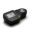 Angled top view of Milwaukee MA884 refractometer with active LCD showing Brix and temperature