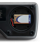 Close-up of the open battery compartment on the Milwaukee MA884 refractometer with a 9V battery installed