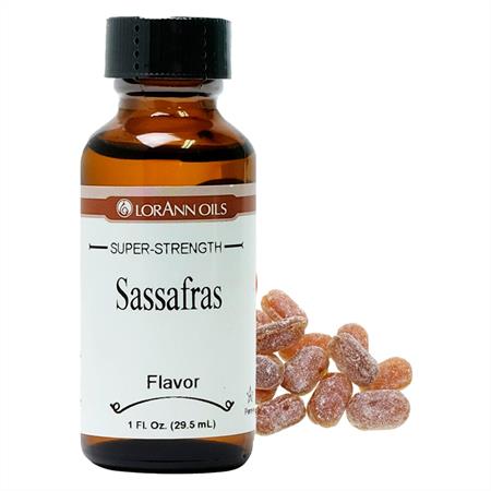 Bottle of LorAnn Oils Sassafras flavor with a small pile of sassafras candies on a white background