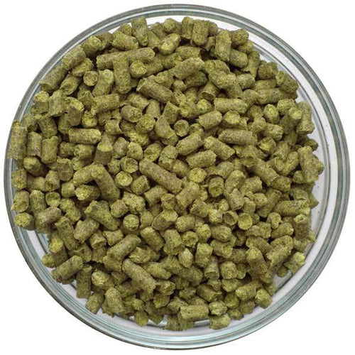 Helios hop pellets in a glass bowl on a white background