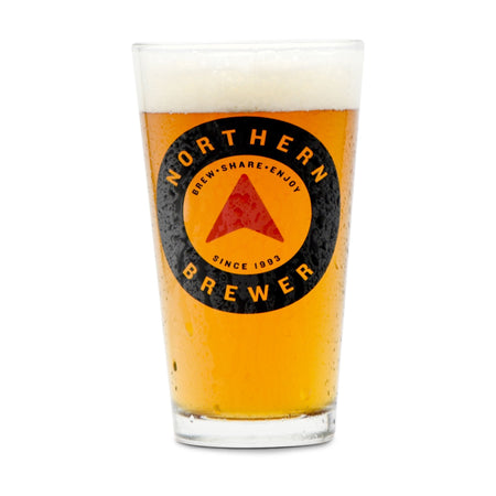 A northern brewer pint glass filled with homebrew