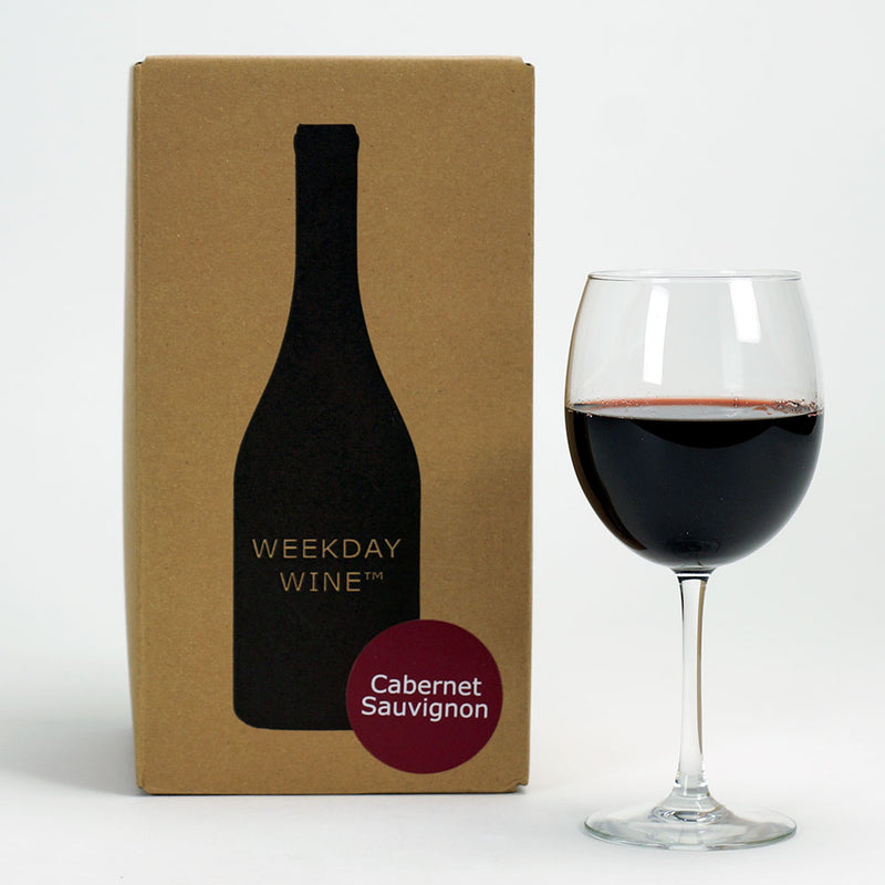 A Cab Sauv recipe kit box beside a wine glass