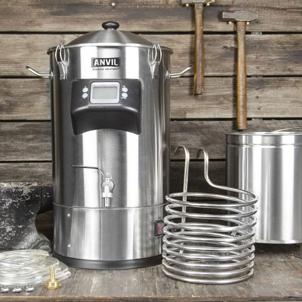 ANVIL Foundry™ 6.5 Gallon All-In-One Electric Brewing System showing individual components: grain basket, immersion chiller and tubing are next to the main unit