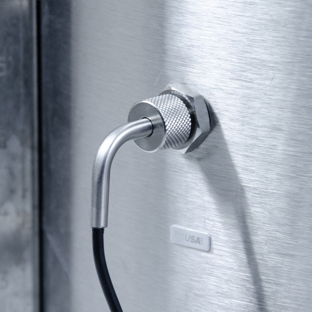 Exterior view of a brew kettle showing the Brewhouse Controller's thermometer entering the kettle