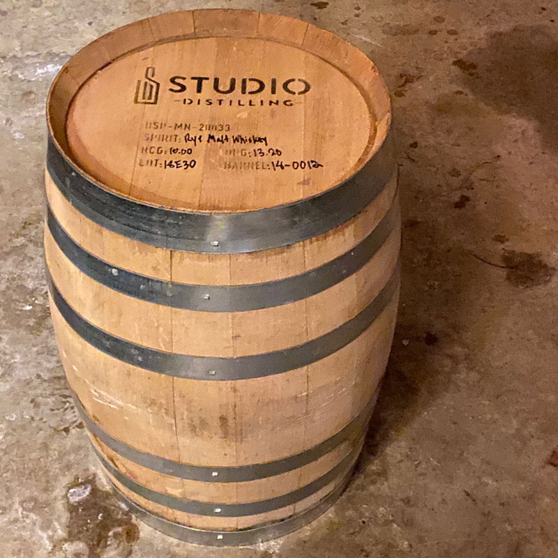 Studio Distilling Barrel on the end showing head with distillery info