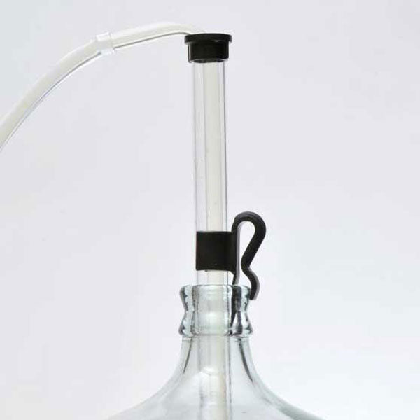 Clamp holding the auto-siphon in a carboy