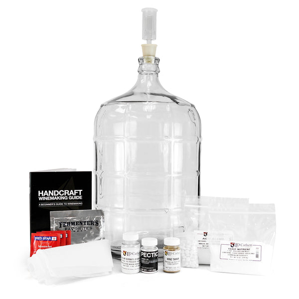 Master Vintner Fresh Harvest 5-Gallon Upgrade, containing a winemakers handbook, 5-gallon glass carboy, straining bag, and various chemicals for cleaning and stabilizing