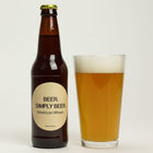 5-Gallon American Wheat Homebrew in a glass beside its bottle