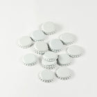 White Bottle Caps in a pile