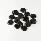 Black Bottle Caps in a pile