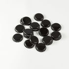 Black Bottle Caps in a pile
