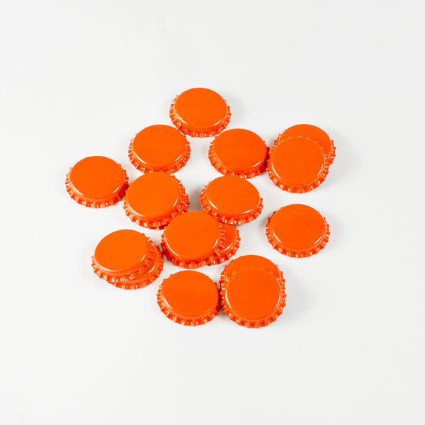 Orange Bottle Caps in a pile